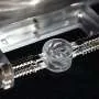 Water-surface vortices drive tiny rotors without electricity, magnets or chemicals