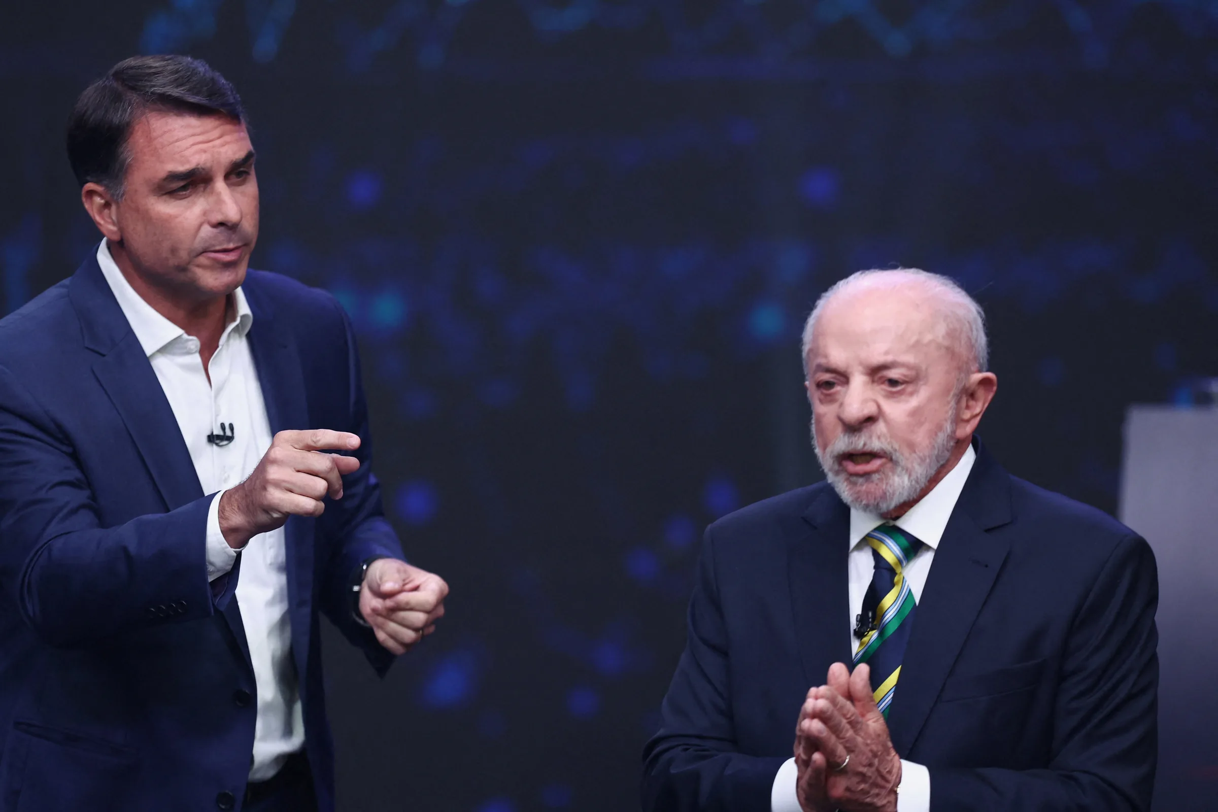 Lula e Flávio Bolsonaro se enfrentam no primeiro debate